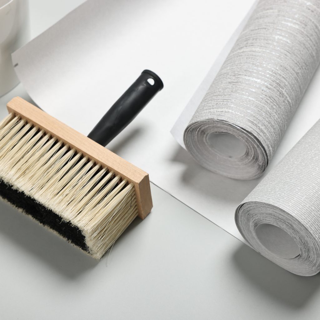 Different,Wallpaper,Rolls,And,Brush,On,Light,Grey,Background